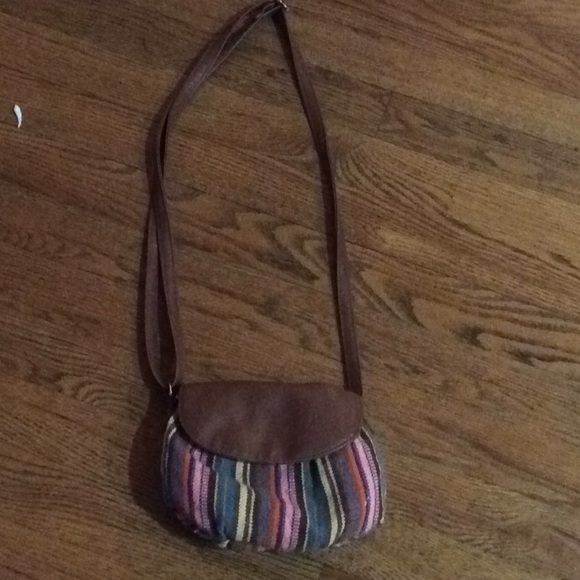 a little purse with a zipper and magnetic shut. - Picture 1 of 3